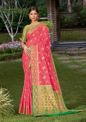 Look Attractive Wearing This Pink Colored Saree Paired With Green Colored Blouse.  This Heavy Designer Saree Is Banarasi Silk Based Which Gives A Rich Look To Your Personality. Buy This Pretty Saree Now.