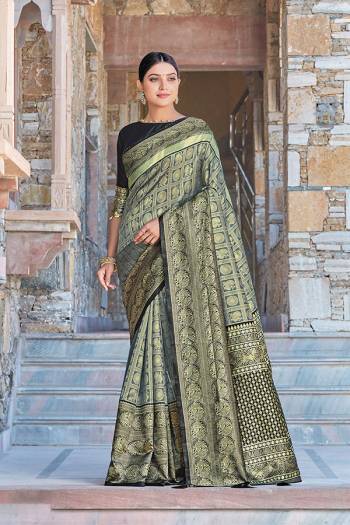 Celebrate This Festive Season In This Very Pretty Colored Designer Saree Paired With Contrasting Colored Blouse. This Saree and Blouse Silk Based Beautified With Detailed Wevon Jari Jacquard Work. 