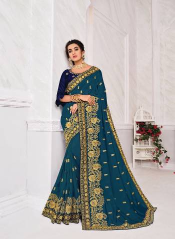 Celebrate This Festive Season In This Very Navy Blue Colored Saree Paired with Navy Blue Blouse. This Saree Are Blooming Vichitra Silk and Blouse Are Art Silk Based Beautified With Detailed Embroidery Work Are Both. 