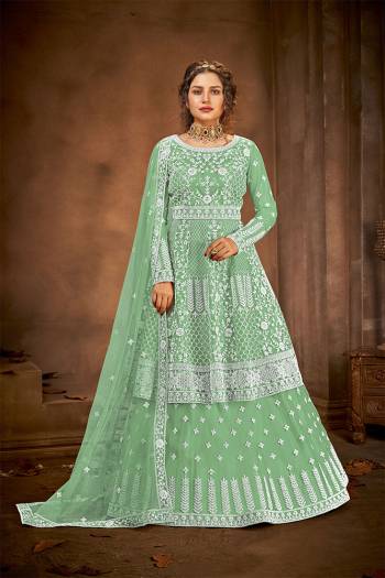 Look Pretty This Designer Floor Length Suit In Lovely  Color.?Its Pretty Embroidred And Stone Work Top And Bottom Is Net Based Paired With And Net Fabricated Embroidered With Stone Work Dupatta Which Gives An Attractive To The Suit.