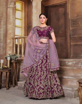 This Wedding Session Heavy Designer Lehenga Choli In Wine Color Fabricated On Silk Beautified With Heavy Attractive Embroidery And Net Fabricated Dupatta. 