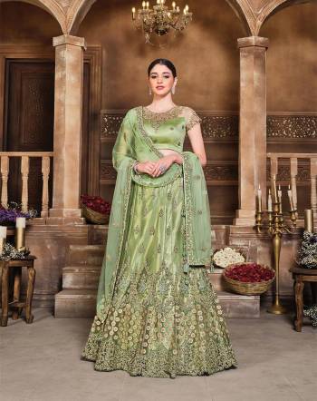 This Wedding Session Heavy Designer Lehenga Choli In Pastel Green Color Fabricated On Net Beautified With Heavy Attractive Embroidery And Net Fabricated Dupatta. 