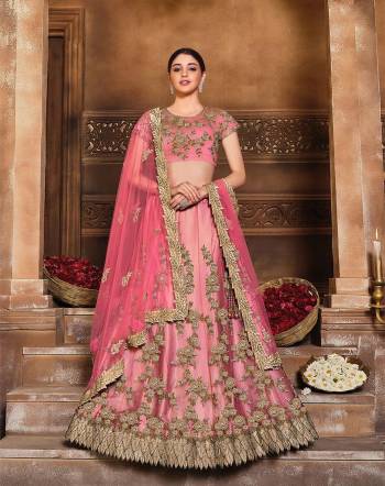 This Wedding Session Heavy Designer Lehenga Choli In Tomato Red Color Fabricated On Net Beautified With Heavy Attractive Embroidery And Net Fabricated Dupatta. 