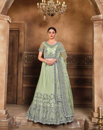 This Wedding Session Heavy Designer Lehenga Choli In Sea Green Color Fabricated On Net Beautified With Heavy Attractive Embroidery And Net Fabricated Dupatta. 