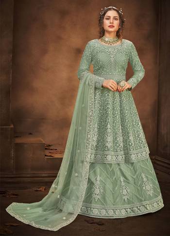 Look Pretty This Designer Floor Length Suit In Lovely Fennel Green Color.?Its Pretty Embroidred And Stone Work Top And Bottom Is Net Based Paired With And Net Fabricated Embroidered With Stone Work Dupatta Which Gives An Attractive To The Suit.