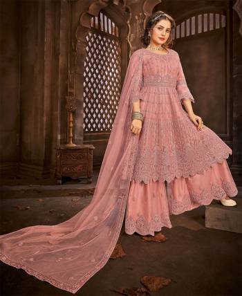 Look Pretty This Designer Floor Length Suit In Lovely Salmon Color.?Its Pretty Embroidred And Stone Work Top And Bottom Is Net Based Paired With And Net Fabricated Embroidered With Stone Work Dupatta Which Gives An Attractive To The Suit.