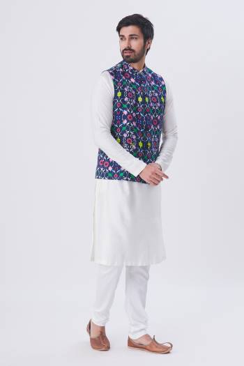 Here Is A Rich And Decent Looking Readymade Pair Of Men's Kurta Pyjama With Jacket. This Kurta And Pyjama Are Fabricated On Raw Silk Paired With Satin Printed Fabricated Jacket. Buy This Pair For The Upcoming Wedding And Festive Season. 

