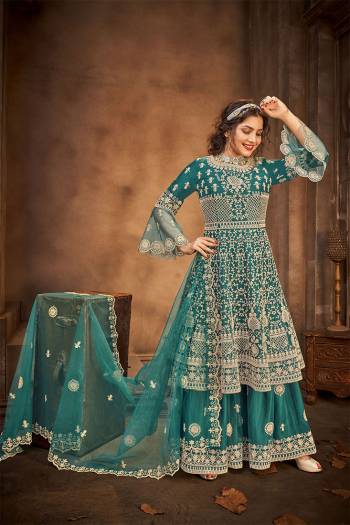 Go with The Lovely Shades Of Rama Wearing This Designer Straight Suit. Its Top Is Fabricated On Net Paired With Net Fabricated Bottom And Net Fabricated Dupatta with Heavy Embroidery Stone Work. 

