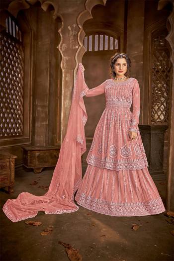 Add This Very Beautiful Heavy Designer Suit To Your Wardrobe In All Over Salmon Color. Its Embroidered And Stone Work Top, Bottom and Dupatta Are Fabricated On Net Which Is Light In Weight and Easy To Carry Throughtout The Gala. 

