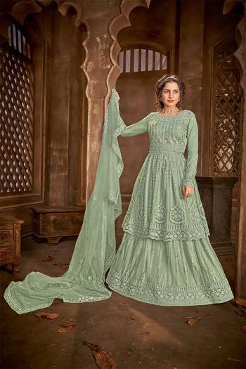 Add This Very Beautiful Heavy Designer Suit To Your Wardrobe In All Over Green Color. Its Embroidered And Stone Work Top, Bottom and Dupatta Are Fabricated On Net Which Is Light In Weight and Easy To Carry Throughtout The Gala. 

