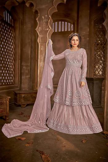 Add This Very Beautiful Heavy Designer Suit To Your Wardrobe In All Over Pink Color. Its Embroidered And Stone Work Top, Bottom and Dupatta Are Fabricated On Net Which Is Light In Weight and Easy To Carry Throughtout The Gala. 

