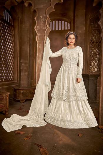 Add This Very Beautiful Heavy Designer Suit To Your Wardrobe In All Over Beige Color. Its Embroidered And Stone Work Top, Bottom and Dupatta Are Fabricated On Net Which Is Light In Weight and Easy To Carry Throughtout The Gala. 

