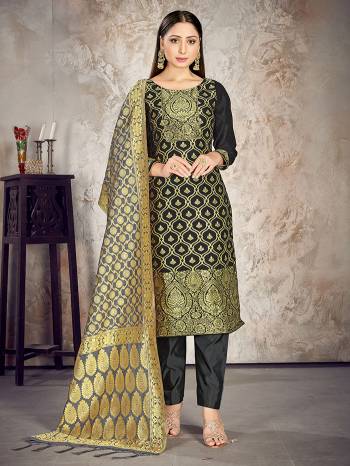 Here Is A Rich And Elegant Looking Silk Based Straight Suit In Dark Colored Top Paired With Matching Colored Bottom And Dupatta. Its Top And Dupatta Are Fabricated On Banarasi Silk Paired with Art Silk Bottom.

