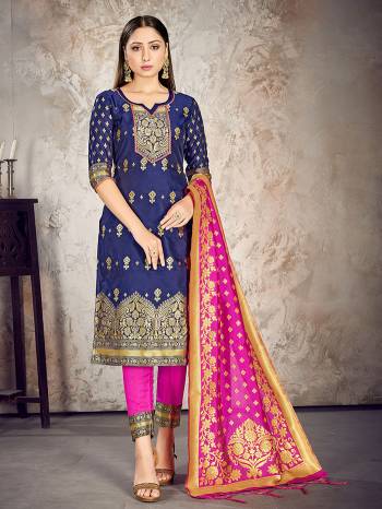 Here Is A Rich And Elegant Looking Silk Based Straight Suit In Dark Colored Top Paired With Matching Colored Bottom And Dupatta. Its Top And Dupatta Are Fabricated On Banarasi Silk Paired with Art Silk Bottom.

