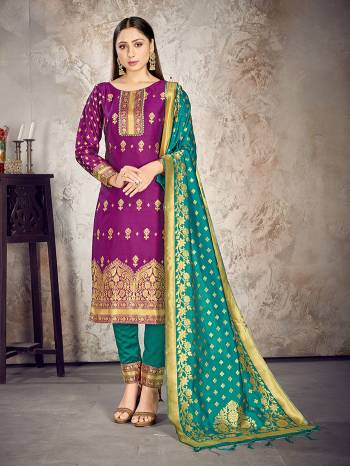 Here Is A Rich And Elegant Looking Silk Based Straight Suit In Dark Colored Top Paired With Matching Colored Bottom And Dupatta. Its Top And Dupatta Are Fabricated On Banarasi Silk Paired with Art Silk Bottom.

