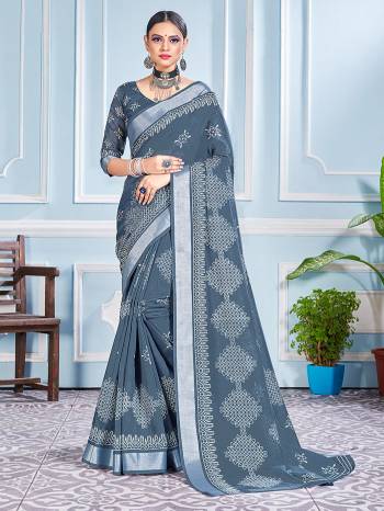 This Festive Season In This Very Pretty Grey Colored Designer Saree Paired With Blouse. This Saree and Blouse Are Cotton Silk Based Beautified With Detailed Designer Printed Saree.  