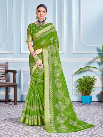 This Festive Season In This Very Pretty Mahendi Colored Designer Saree Paired With Blouse. This Saree and Blouse Are Cotton Silk Based Beautified With Detailed Designer Printed Saree.  