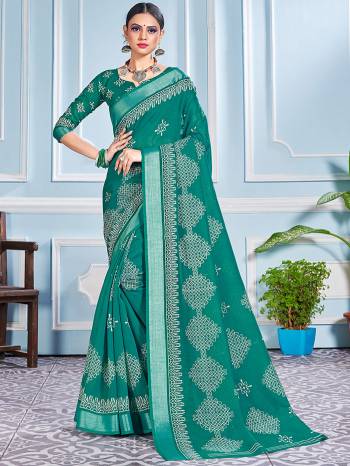 This Festive Season In This Very Pretty Teal Colored Designer Saree Paired With Blouse. This Saree and Blouse Are Cotton Silk Based Beautified With Detailed Designer Printed Saree.  