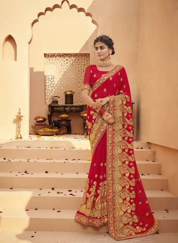 Celebrate This Wedding Festive Season In This Very Pretty Red Colored Designer Saree Paired With Matching Colored Blouse. This Saree and Blouse Are Heavy Blooming Georgette Based Beautified With Detailed Heavy Embroidery And Diamond Work. 