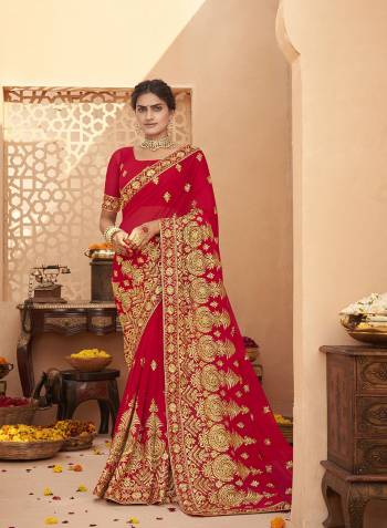 Celebrate This Wedding Festive Season In This Very Pretty Red Colored Designer Saree Paired With Matching Colored Blouse. This Saree and Blouse Are Heavy Blooming Georgette Based Beautified With Detailed Heavy Embroidery And Diamond Work. 