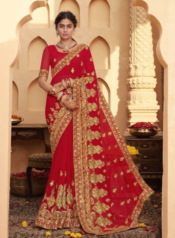 Celebrate This Wedding Festive Season In This Very Pretty Red Colored Designer Saree Paired With Matching Colored Blouse. This Saree and Blouse Are Heavy Blooming Georgette Based Beautified With Detailed Heavy Embroidery And Diamond Work. 