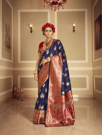 Look Attractive Wearing This Nevy Blue Colored Saree Paired With Red Colored Blouse.  This Heavy Designer Saree Is Banarasi Silk Wevon Jacquard Based Which Gives A Rich Look To Your Personality. Buy This Pretty Saree Now.