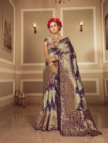 Look Attractive Wearing This Grey Colored Saree Paired With Grey Colored Blouse.  This Heavy Designer Saree Is Banarasi Silk Wevon Jacquard Based Which Gives A Rich Look To Your Personality. Buy This Pretty Saree Now.