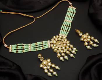 Give An Enhanced Look To Your Personality By Pairing Up This Beautiful Necklace Set With Your Ethnic Attire. This Pretty Set Is In Color Beautified With Pearl And Stone Work. Buy Now.