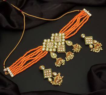 Give An Enhanced Look To Your Personality By Pairing Up This Beautiful Necklace Set With Your Ethnic Attire. This Pretty Set Is In Color Beautified With Pearl And Stone Work. Buy Now.