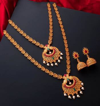 An Enhanced Look To Your Personality By Pairing Up This Beautiful Necklace Set With Your Ethnic Attire. This Pretty Set Is In Gold Color Beautified With Temple Work. Buy Now.