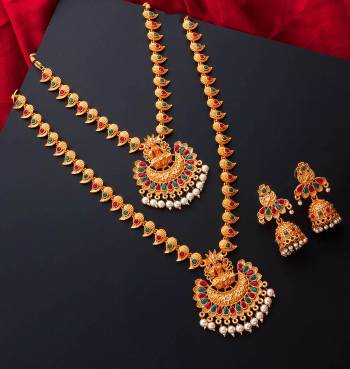 An Enhanced Look To Your Personality By Pairing Up This Beautiful Necklace Set With Your Ethnic Attire. This Pretty Set Is In Gold Color Beautified With Temple Work. Buy Now.