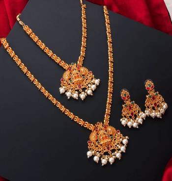 An Enhanced Look To Your Personality By Pairing Up This Beautiful Necklace Set With Your Ethnic Attire. This Pretty Set Is In Gold Color Beautified With Temple Work. Buy Now.