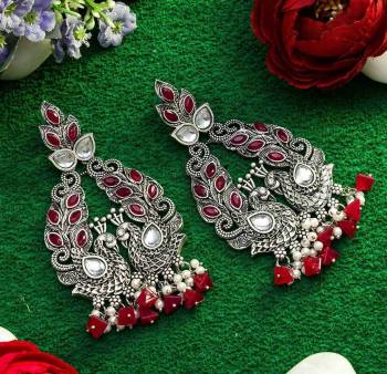 An Enhanced Look To Your Personality By Pairing Up This Beautiful Earring Set With Your Ethnic Attire. This Pretty Set Is In Silver Color Beautified With Kundan Work. Buy Now.