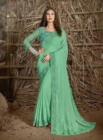 Celebrate This Festive Season In This Very Pretty Sea Green Colored Designer Saree Paired With Blouse. This Saree and Blouse Are Chiffon Based Beautified With Detailed Cut Work Heavy Embroidery And Machine Diamond Work. 