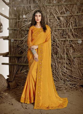 Celebrate This Festive Season In This Very Pretty Musturd Yellow Colored Designer Saree Paired With Blouse. This Saree and Blouse Are Chiffon Based Beautified With Detailed Cut Work Heavy Embroidery And Machine Diamond Work. 