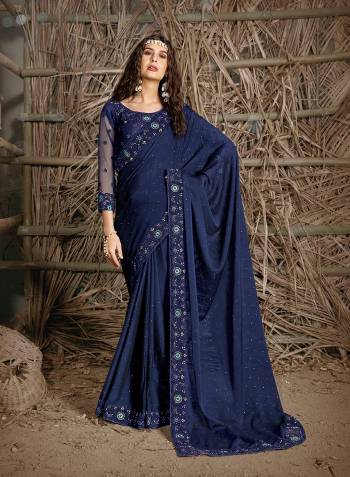 Celebrate This Festive Season In This Very Pretty Nevy Blue Colored Designer Saree Paired With Blouse. This Saree and Blouse Are Chiffon Based Beautified With Detailed Cut Work Heavy Embroidery And Machine Diamond Work. 