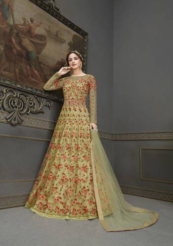 Flaunt Your Rich And Elegant Taste Wearing This Designer Semi-Stitched Floor Length Gown In Khaki Color Paired With Khaki Colored Dupatta. This Pretty Gown And Dupatta Are Fabricated On Net Beautified With Pretty Embroidery And Hand Work Giving An Attractive Look. 