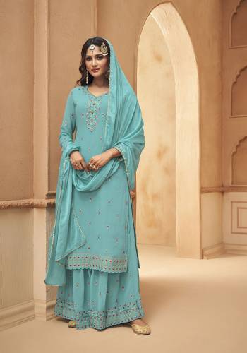 This Festive And Wedding Season, Be The Most Beautiful Diva Wearing This Designer Straight Suit In Dusty Fine Color. Its Embroidered With Hand Work Top Is Fabricated on Georgette Paired With Georgette Work Bottom And Chiffon Swarovski  Dupatta. Buy Now. 

