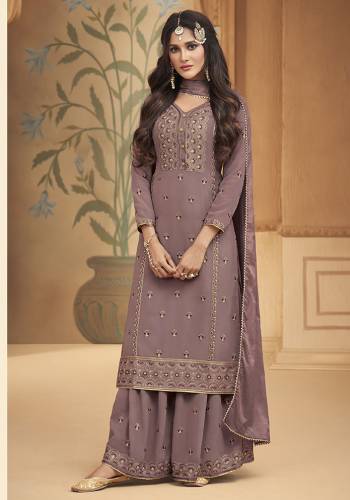 This Festive And Wedding Season, Be The Most Beautiful Diva Wearing This Designer Straight Suit In Dusty Fine Color. Its Embroidered With Hand Work Top Is Fabricated on Georgette Paired With Georgette Work Bottom And Chiffon Swarovski  Dupatta. Buy Now. 

