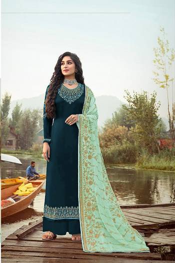 Here Is A Very Pretty Designer Straight Suit In Dark Color. Its?Embroidered Top and Dupatta Are Fabricated On Rangoli Georgette And Faux Georgette Paired with Santoon Fabricated Bottom. Its Fabrics Are Soft Towards Skin And Esnures Superb Comfort All Day Long.