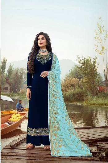 Here Is A Very Pretty Designer Straight Suit In Dark Color. Its?Embroidered Top and Dupatta Are Fabricated On Rangoli Georgette And Faux Georgette Paired with Santoon Fabricated Bottom. Its Fabrics Are Soft Towards Skin And Esnures Superb Comfort All Day Long.