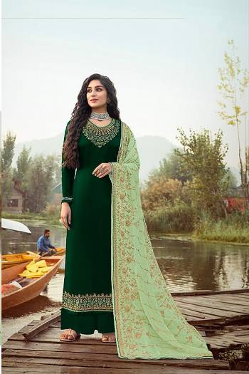 Here Is A Very Pretty Designer Straight Suit In Dark Color. Its?Embroidered Top and Dupatta Are Fabricated On Rangoli Georgette And Faux Georgette Paired with Santoon Fabricated Bottom. Its Fabrics Are Soft Towards Skin And Esnures Superb Comfort All Day Long.