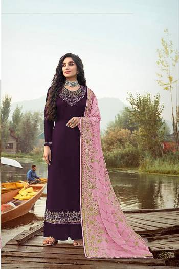 Here Is A Very Pretty Designer Straight Suit In Dark Color. Its?Embroidered Top and Dupatta Are Fabricated On Rangoli Georgette And Faux Georgette Paired with Santoon Fabricated Bottom. Its Fabrics Are Soft Towards Skin And Esnures Superb Comfort All Day Long.