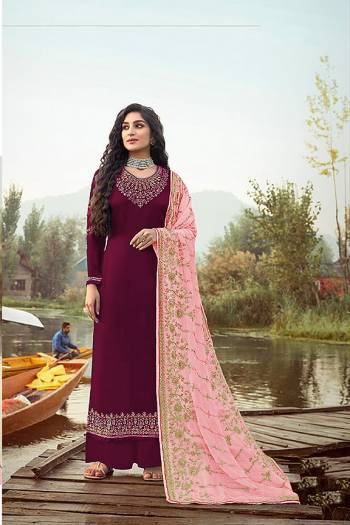 Here Is A Very Pretty Designer Straight Suit In Dark Color. Its?Embroidered Top and Dupatta Are Fabricated On Rangoli Georgette And Faux Georgette Paired with Santoon Fabricated Bottom. Its Fabrics Are Soft Towards Skin And Esnures Superb Comfort All Day Long.