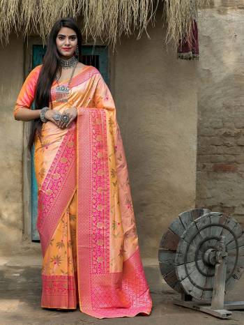 Adorn The Pretty Angelic Look Wearing This Heavy Designer Wevon Saree In Light Orange Color Paired With Light Orange Colored Blouse. This Saree Is Fabricated On Banarasi Silk Paired With Blouse. Its Pretty Color Pallete Will Give An Attractive Look To Your Personality. 