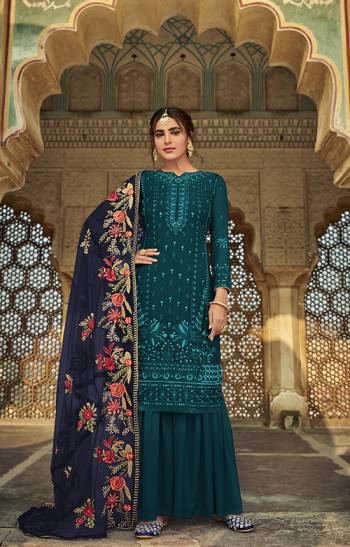 Here Is A Very Pretty Designer Straight Suit In Rama Color And Dupatta In Nevy Blue . Its?Embroidered Top Are Faux Georgette and Dupatta Are Fabricated On Heavy Net Paired with Santoon Fabricated Bottom. Its Fabrics Are Soft Towards Skin And Esnures Superb Comfort All Day Long.