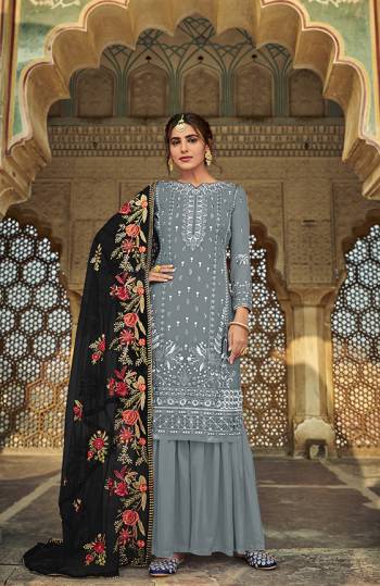 Here Is A Very Pretty Designer Straight Suit In Grey Color And Dupatta In Black . Its?Embroidered Top Are Faux Georgette and Dupatta Are Fabricated On Heavy Net Paired with Santoon Fabricated Bottom. Its Fabrics Are Soft Towards Skin And Esnures Superb Comfort All Day Long.