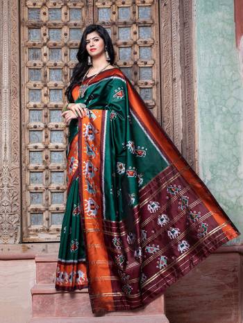 Adorn The Pretty Angelic Look Wearing This Heavy Designer Printed Saree In Rama Color Paired With Contrasting Brown Colored Blouse. This Saree Is Fabricated On Patola Silk Paired With Blouse. Its Pretty Color Pallete Will Give An Attractive Look To Your Personality. 