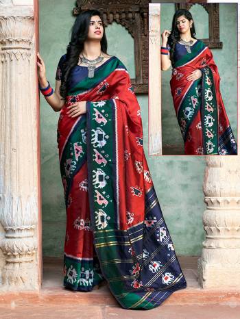 Adorn The Pretty Angelic Look Wearing This Heavy Designer Printed Saree In Red Color Paired With Contrasting Royal Blue Colored Blouse. This Saree Is Fabricated On Patola Silk Paired With Blouse. Its Pretty Color Pallete Will Give An Attractive Look To Your Personality. 