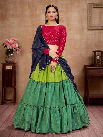 Here Is Lovely and Elegant Looking Designer Lehenga Choli In Rani Colored Blouse Paired With Green Colored Lehenga And Nevy Blue Dupatta. Its Blouse Is Georgette Based Paired With Cotton Fabricated Lehenga And Net Fabricated Dupatta. Buy Now. 